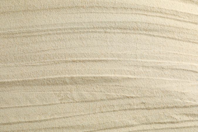 Clear sea sand as background, space for text and closeup. Summer vacation background