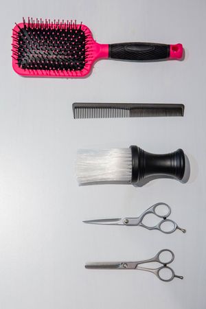 Hairdressing styling tools laid out on table