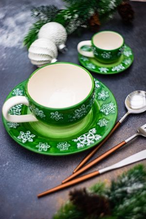 Two green tea and saucers for Christmas