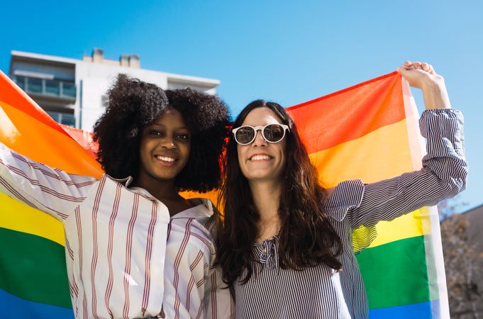 Two women with LGBT flag