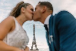 Happy newlyweds in wedding clothing kissing
