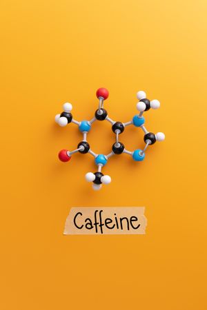 Caffeine molecular structure over orange background