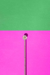 Minimalistic composition of a woman resting in a structure in the lake