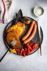 Top view of sausage dinner with toast on a plate