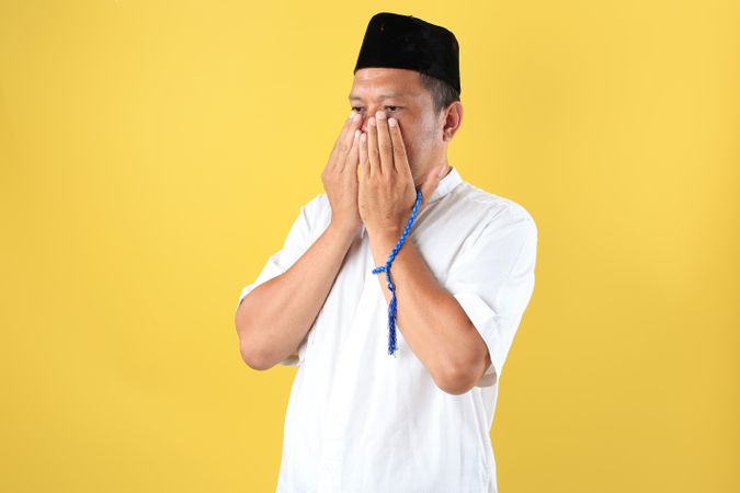 Portrait of Indonesian Mature Man after Wirid Zikir Doa, Wearing Baju Koko and Peci