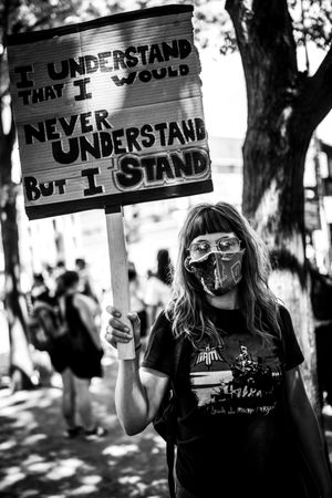 MONTREAL, QUEBEC, CANADA – June 7 2020- Woman holding a sign during a BLM protest