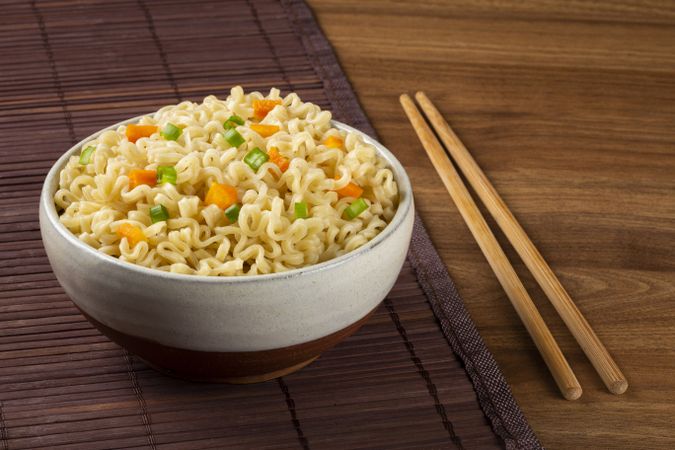 Bowl with instant noodles on the table.