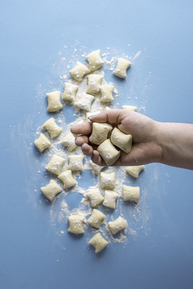 Homemade uncooked gnocchi dumplings tossed in flour