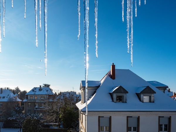 Icicles hang from the roof. Thaw. Spring