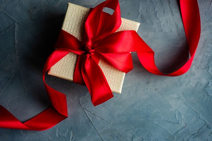 Top view of gift box concept with red ribbon