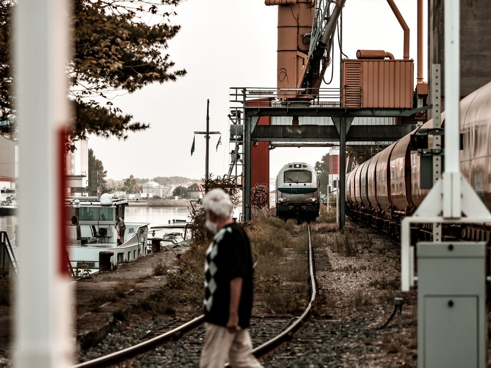 Semaphores. Railway tracks, wagons, Port cranes.