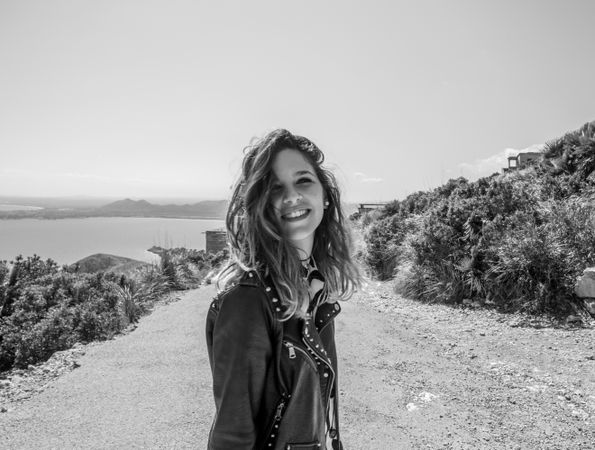 Smiling female on seashore