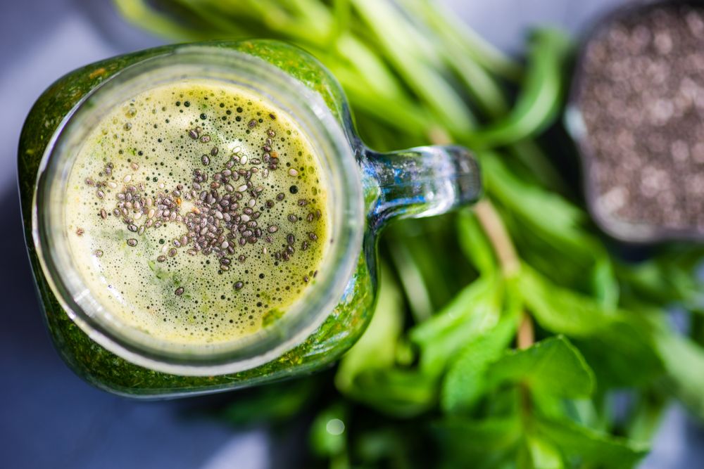 Top view of green smoothie in mason jar with chia seeds