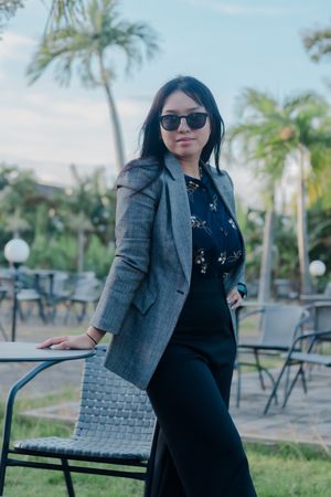 Stylish businesswoman enjoying tropical scenery during work break