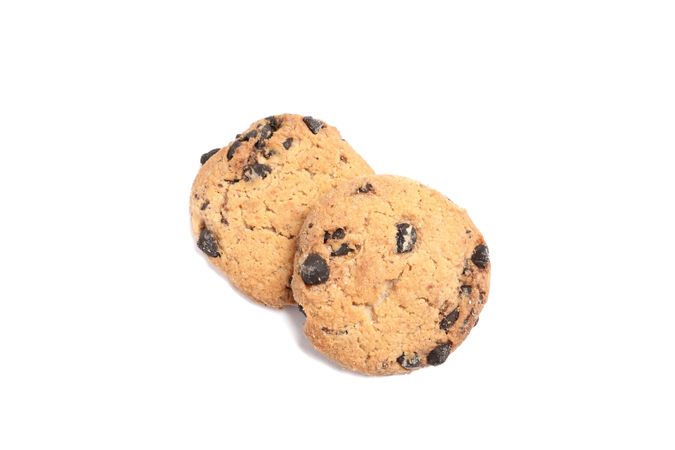 Delicious chocolate chip cookies on plain background