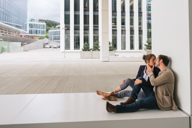 Businesspeople resting outside modern building