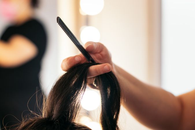 Close-up of the hair of someone being combed