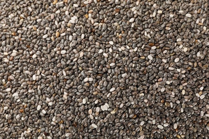 Chia seeds on whole background, close up