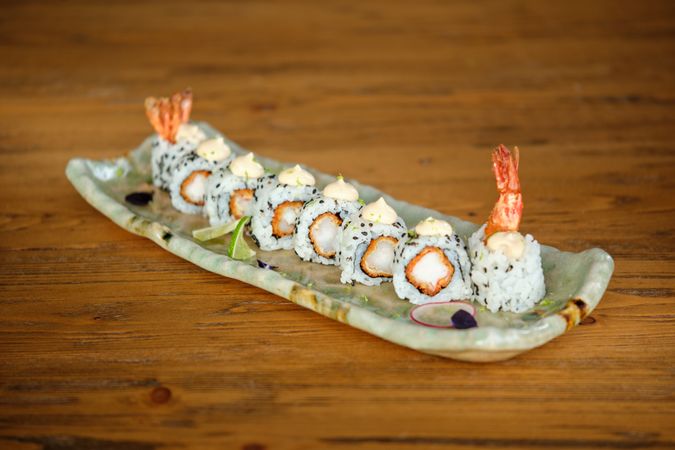 Appetizing sushi set on ceramic tray