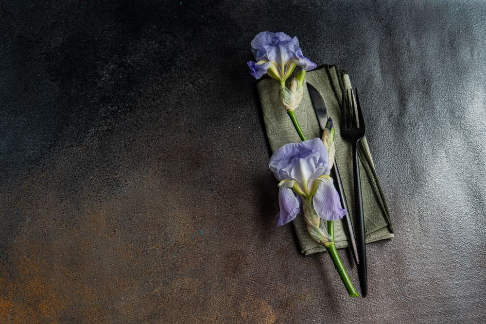 Table setting with pale blue iris flowers