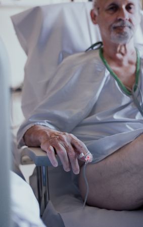 Older man admitted to a hospital room.