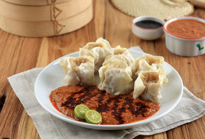 Fish Dumpling Served with Spicy Peanut Sauce and Sweet Soy Sauce