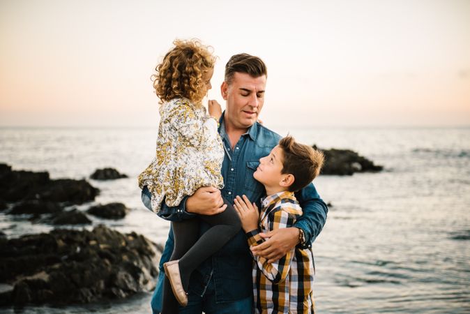Father with her children at beach