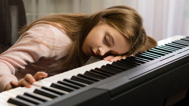 Tired Young Pianist Asleep