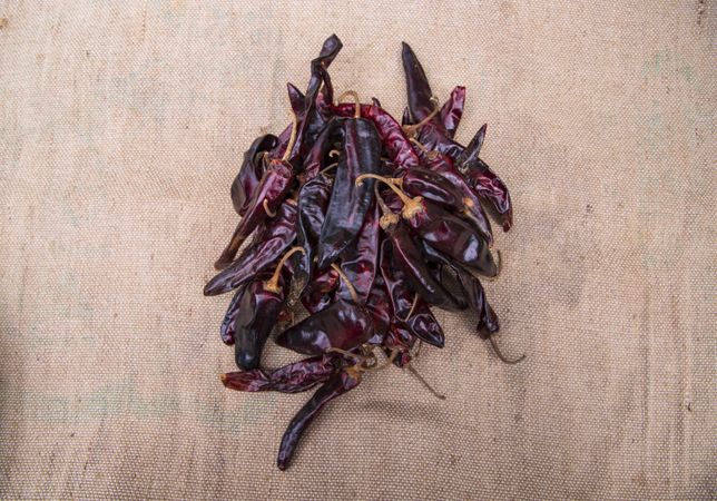 Some Dry Pepper or red chili on the brown jute fiber fabric