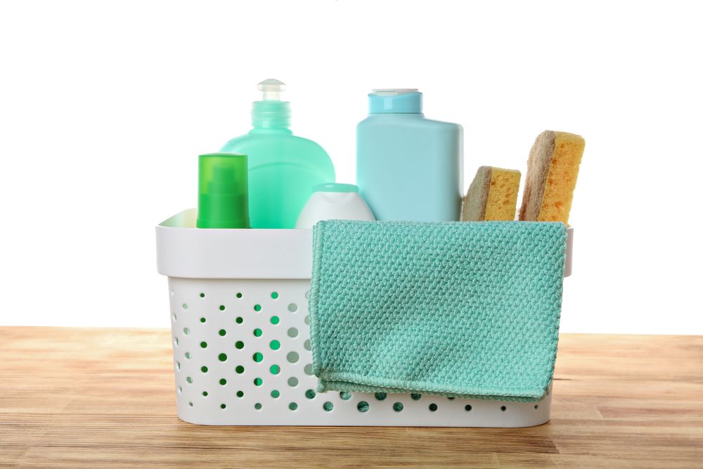 Detergents in a basket, isolated on plain background