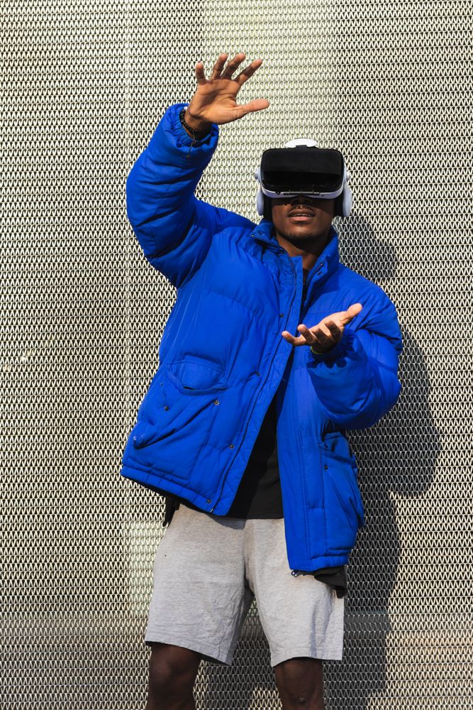 Black man experiencing virtual reality in city