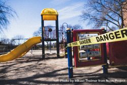 MONTREAL, QUEBEC, CANADA – March 31 2020- An entire playground is closed down with yellow tape 4OLqvb