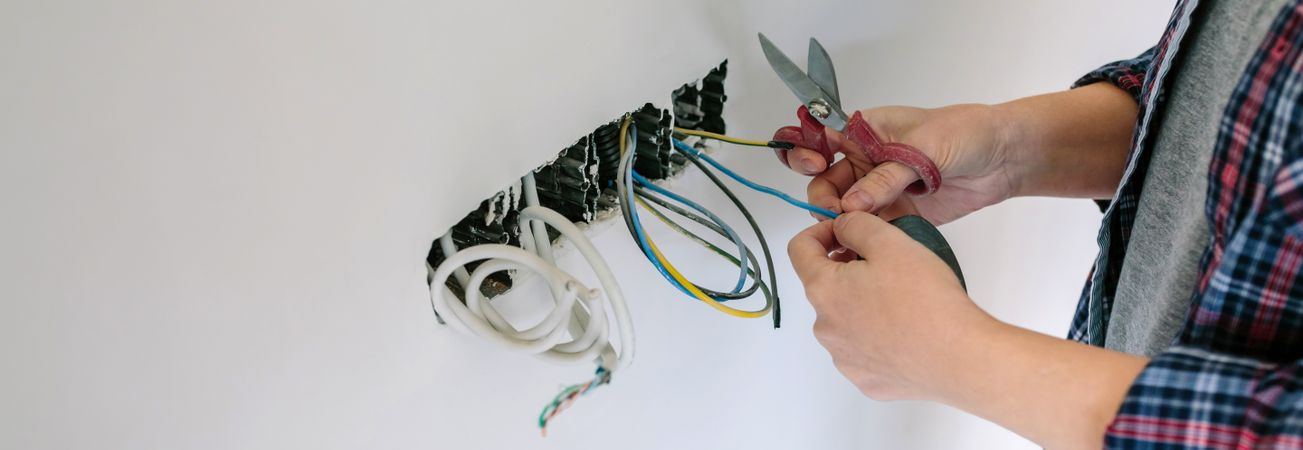 Electrician working on the electrical installation of a house