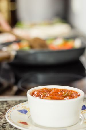 Closeup of bowl of hot sauce prepared for a mexican food