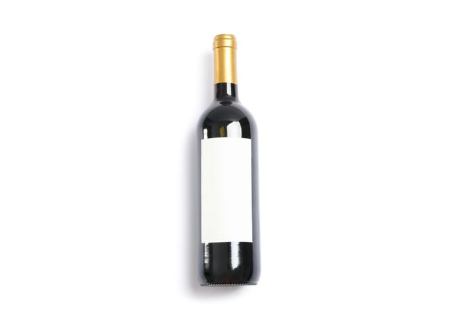Bottle of wine with empty space isolated on plain background