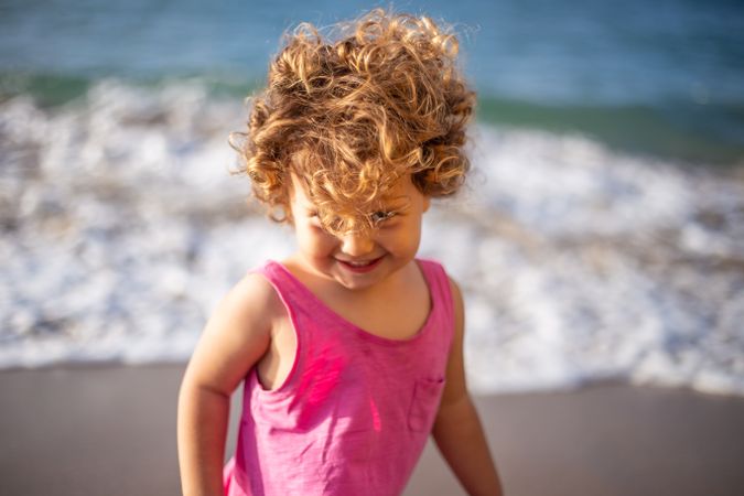 Child near sea on coast