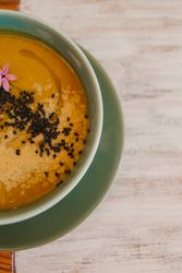 Tasty soup puree with seeds in bowl