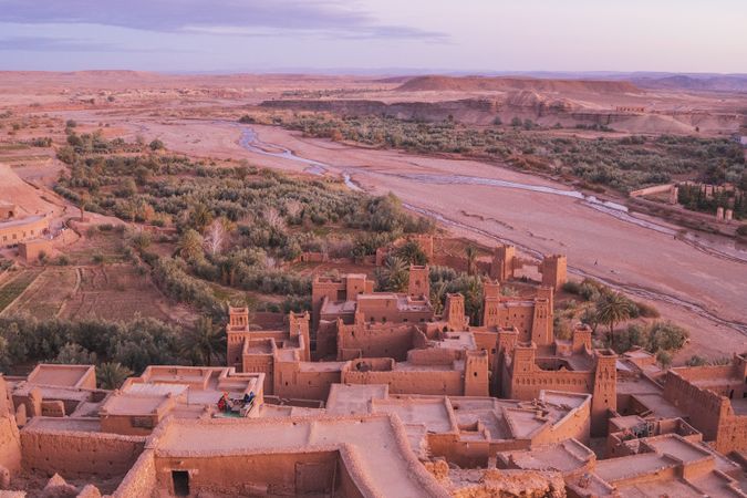Ancient city near river in desert and wonderful sky