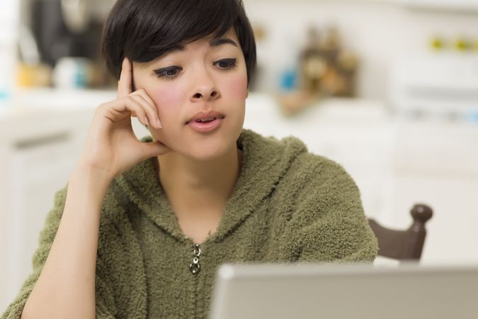 Woman Using Laptop at Home