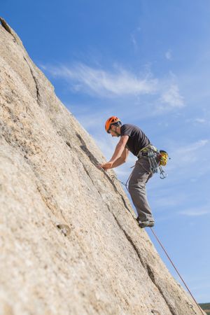 Man climbing a rock