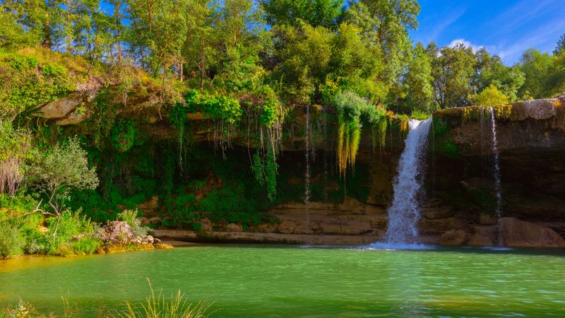 View of beautiful waterfall and lake