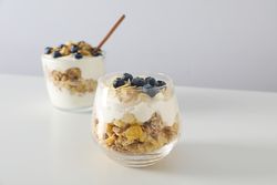 Tasty and nutritious breakfast concept - muesli with yogurt