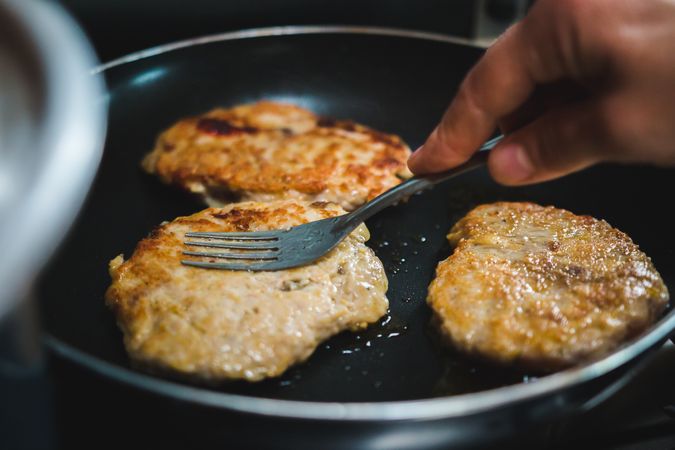 Meat cutlets frying on pan