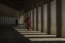 Buddhist monks in hallway in Myanmar