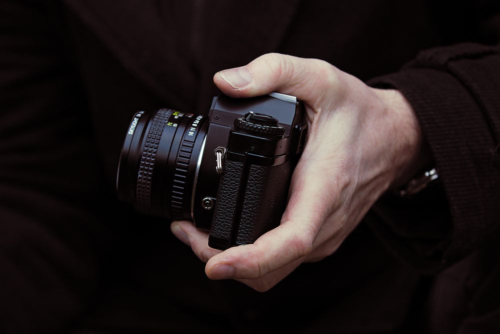 Person holding a camera
