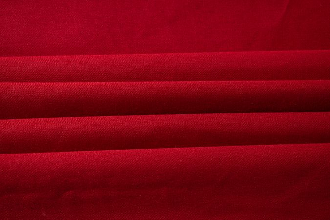 Folded Red fabric background texture.