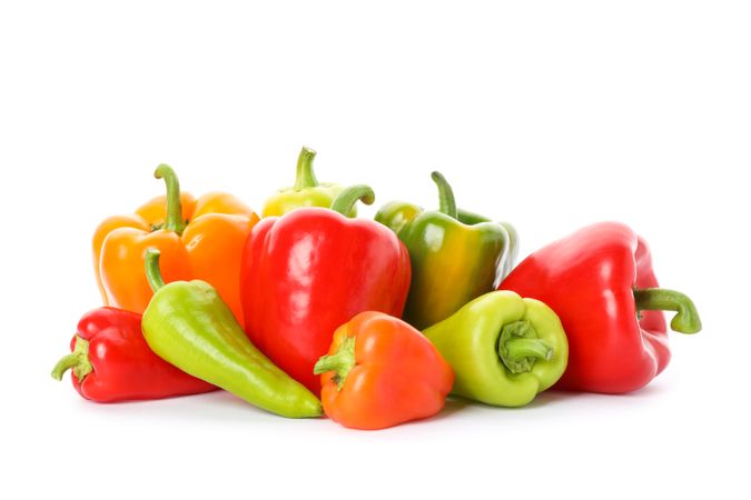 Different tasty peppers isolated on plain background
