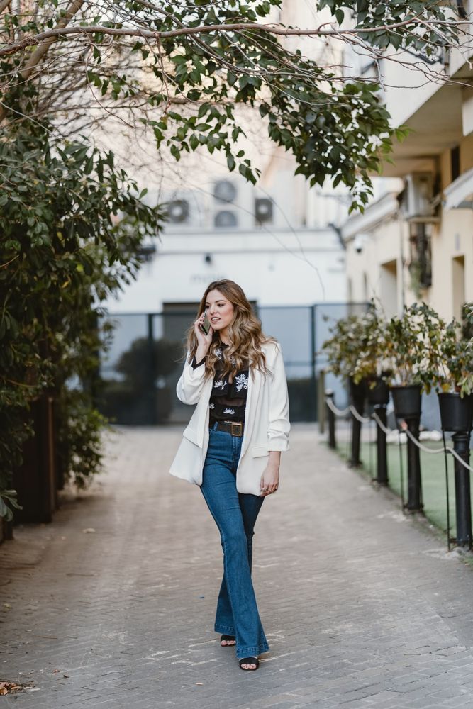 Woman talking phone on street