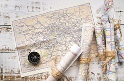 Arrangement of different rolled up paper maps