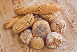 Pile of bread on wooden table